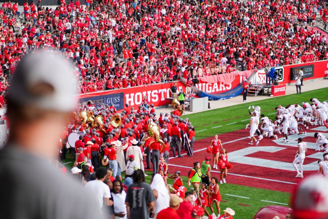 Cheerful fans at a college football game.