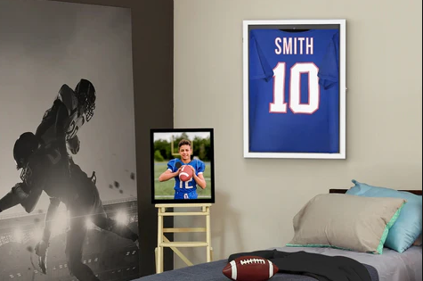 5 Simple Ways To Turn Sports Gear Into Art Football-themed bedroom with framed jersey.